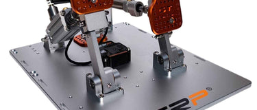 Sim racing pedal kit showing load-cell and pneumatic brake options for premium simulator builds